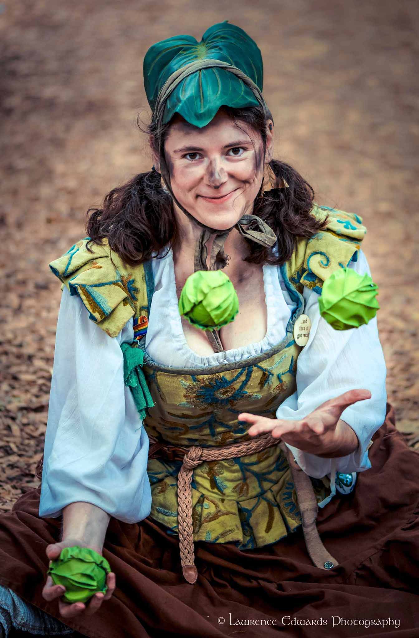 Headshot of Cabbage the Peasant juggling three balls that look like cabbages